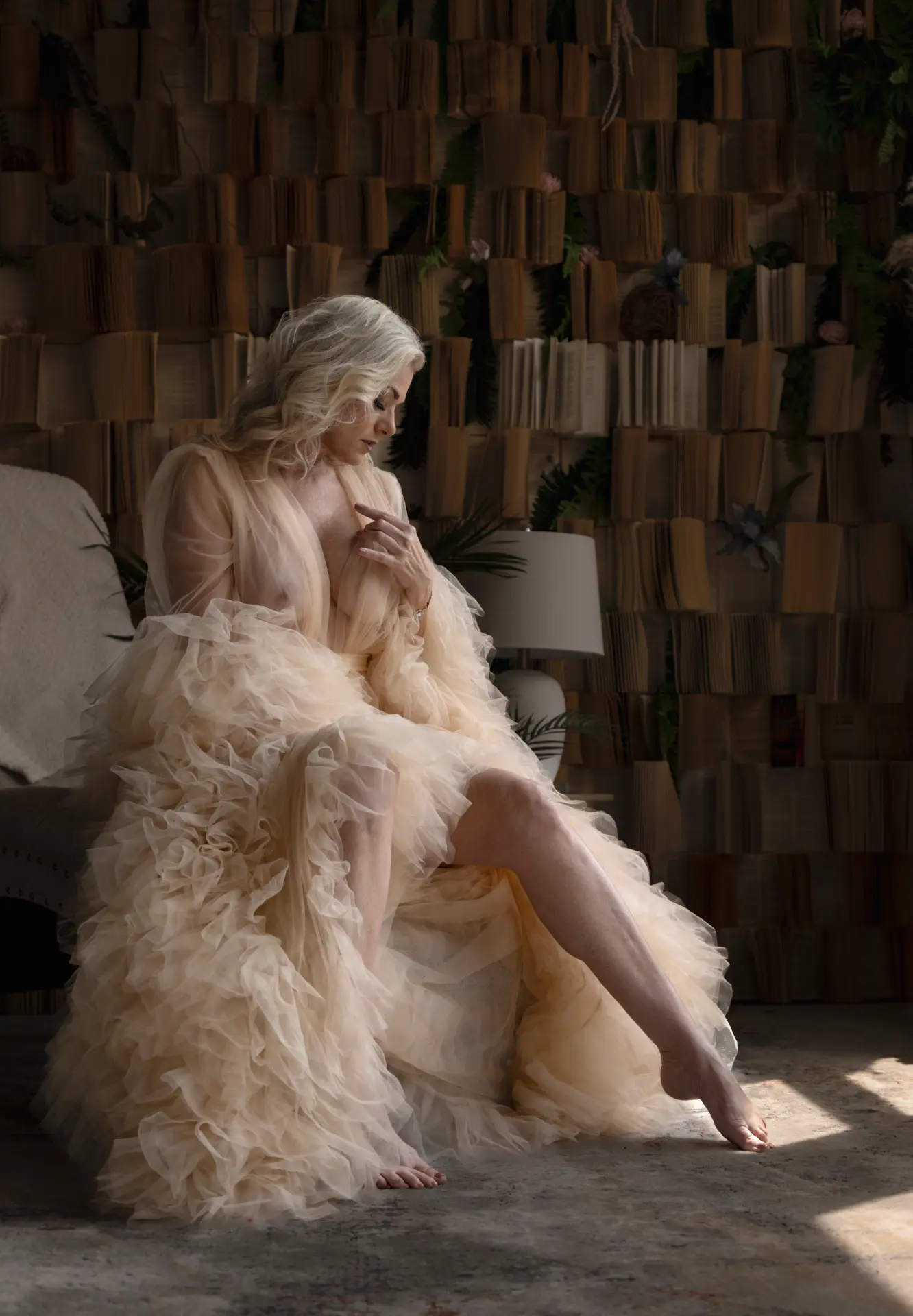River Rose Boudoir client in a silk robe by window light